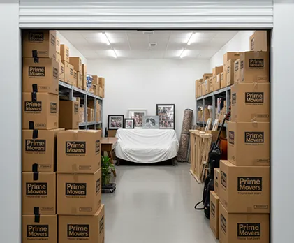 Household shifting unit with well-arranged boxes, furniture, and personal items, packed for safety